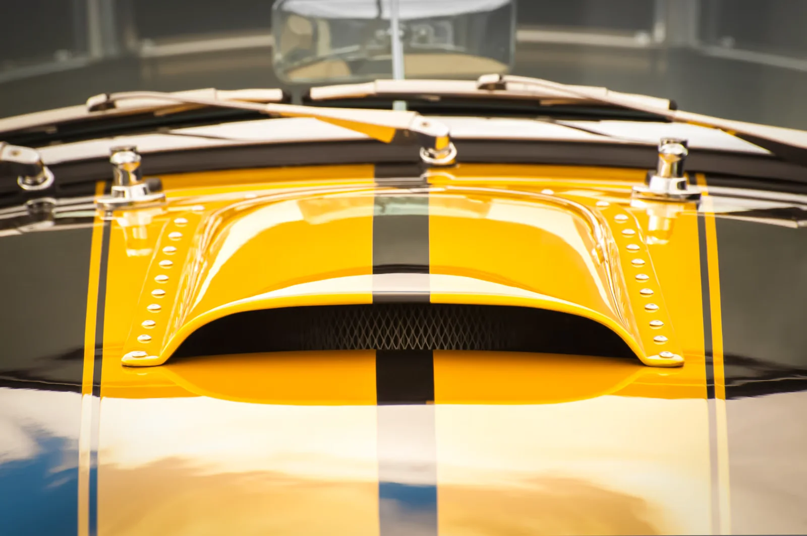custom hood air intake with yellow and black sports paint job