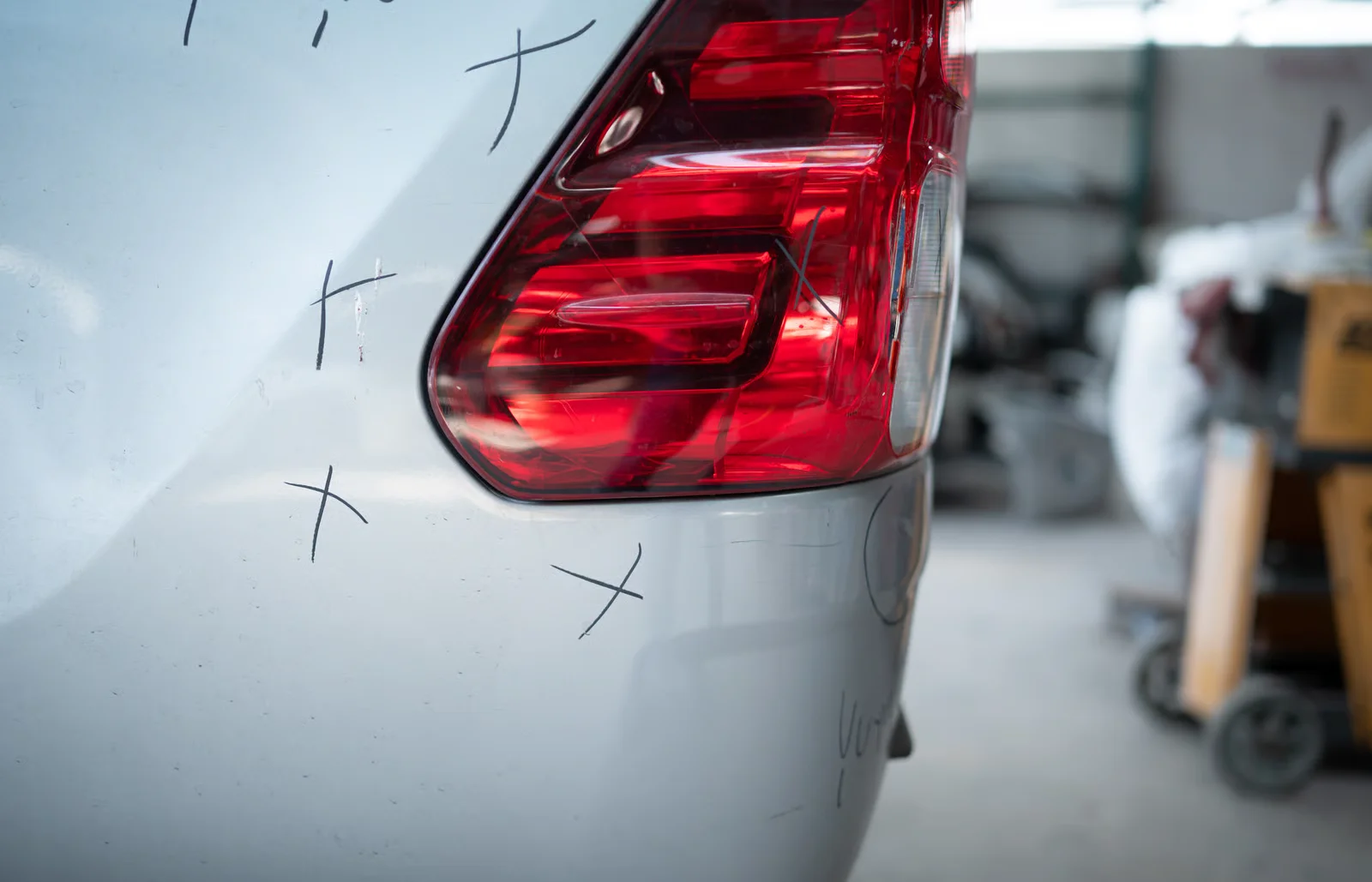 taillight repair preparation in auto body shop