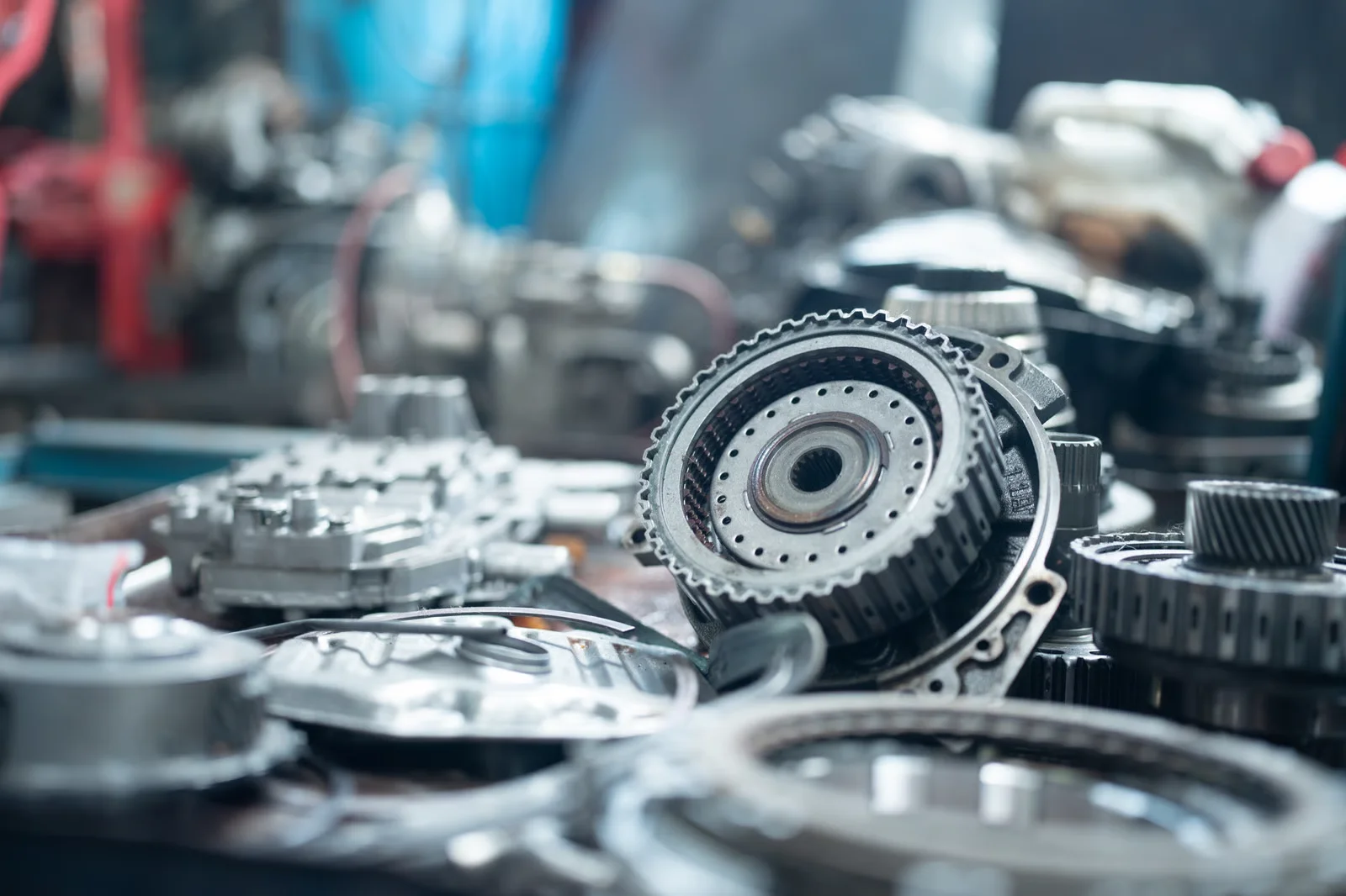 car transmission parts scattered on a workbench