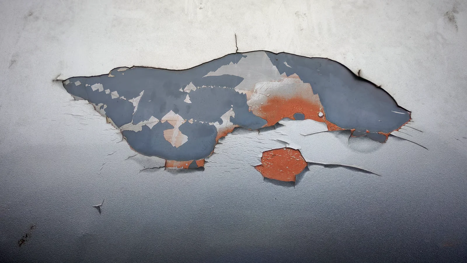 peeling paint with orange underlay texture