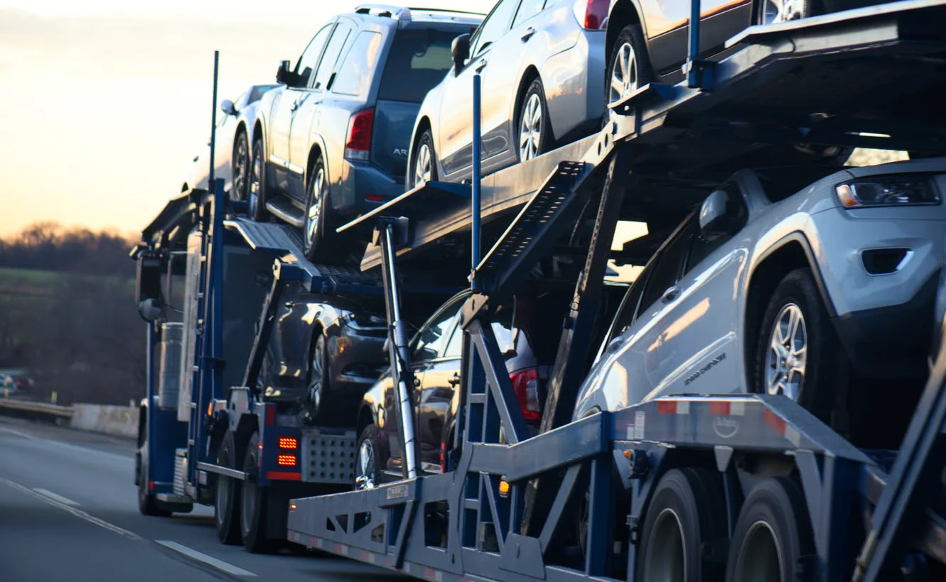 truck transporting automobiles on a highway